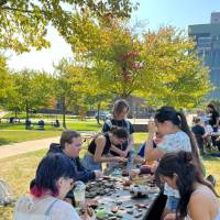 students reassembling broken artifacts